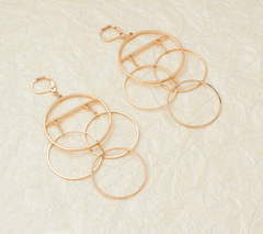 The Claire - Gold Tone Dangle Earrings of Connecting Hoops