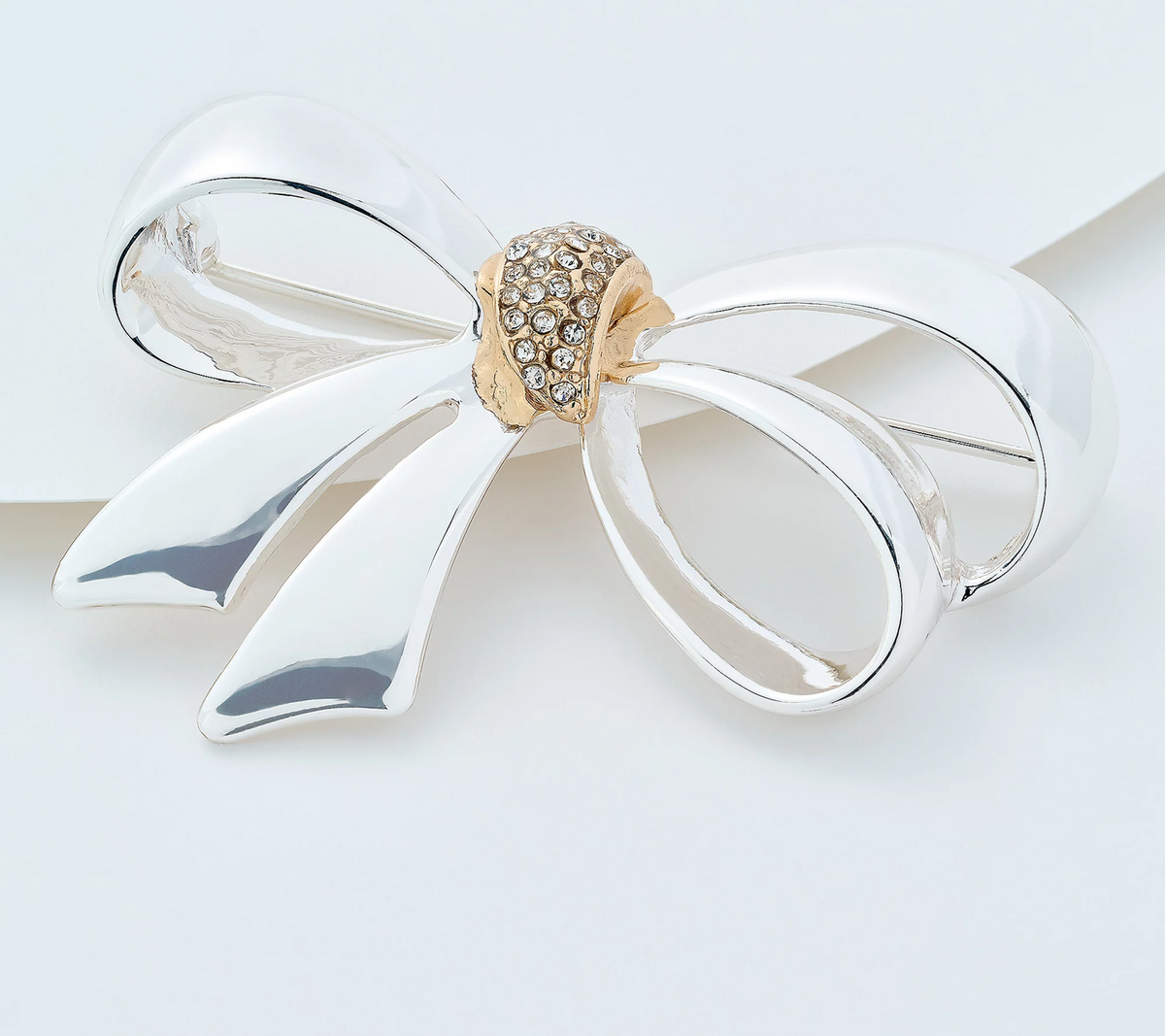 Joan Rivers Silvertone Polished Bow Pin with Pave Stones